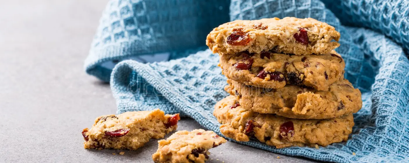 Low FODMAP Oat Cookies with cranberries on blue tea towel